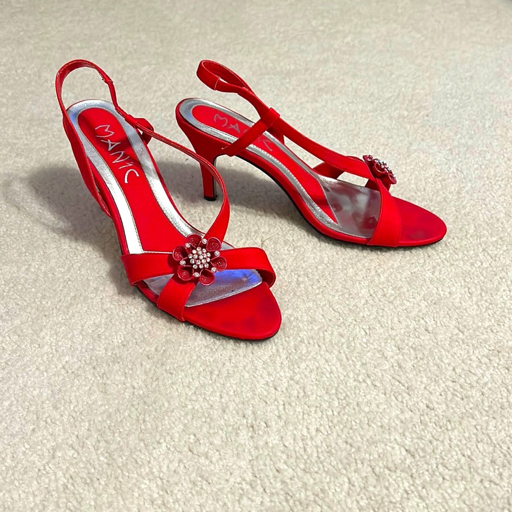 Red high heel shoes. Brand Manic